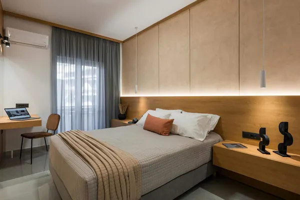 Bedroom with timber panelling and concealed lighting, Amara Local Experience, Chania