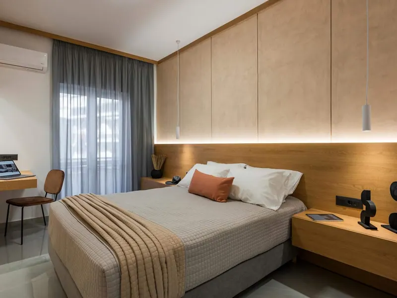 Bedroom with timber panelling and concealed lighting, Amara Local Experience