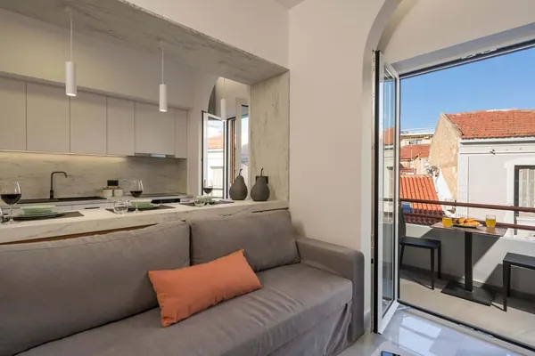 Sofa bed beside the open window with rooftop view, Amara Local Experience, Chania