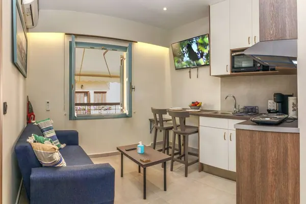 Open-plan living area and kitchen with breakfast bar, Amara Porto Living Apartment 1, Chania Old Town