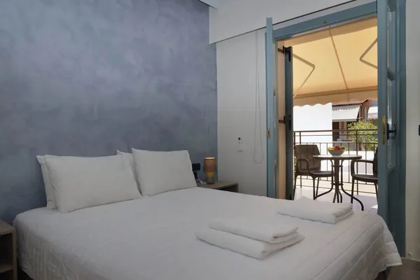 Double bed beside open balcony doors, Amara Porto Living Apartment 2, Chania
