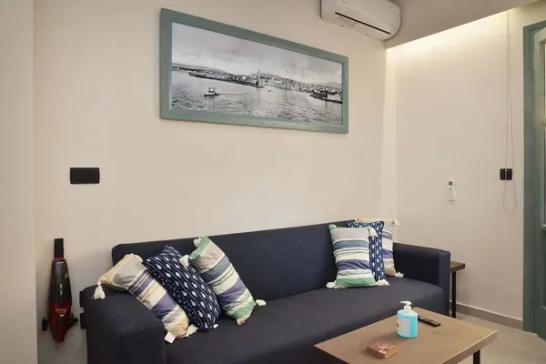 Sofa with cushions and coffee table in the living area, Amara Porto Living Apartment 2