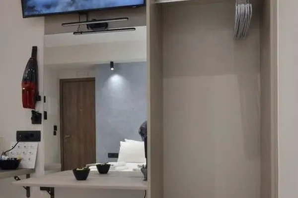 Double bed with smart TV and wardrobe, Amara Porto Living Studio, Chania