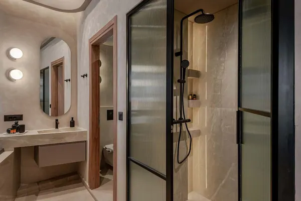 Bathroom with basin and glass walk-in shower, Amara Luxury Suite with City Balcony