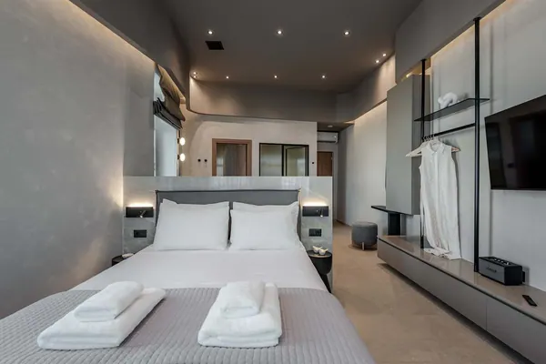 Bedroom with smart TV and full-height wardrobe, Amara Luxury Suite with City Balcony