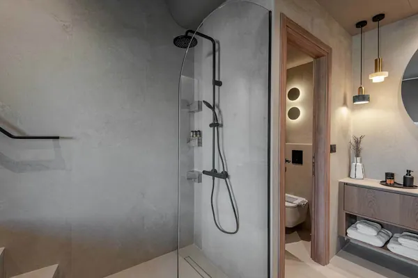 Walk-in rain shower finished in microcement, Amara Luxury Suite with Terrace, Chania