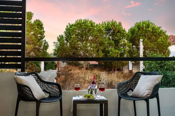 Balcony table and chairs at sunset, Solar Apartments by Amara Living, Agia Marina