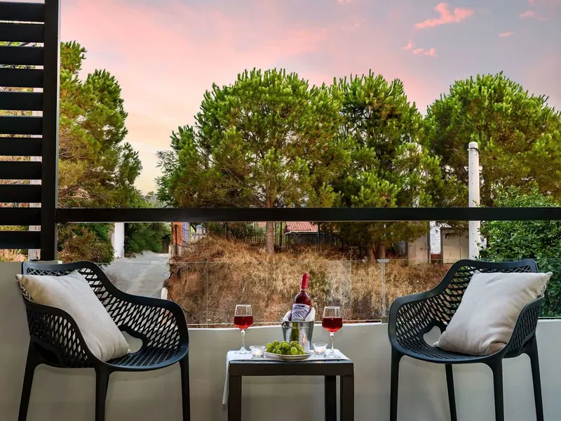 Balcony table and chairs at sunset, Solar Apartments, Agia Marina