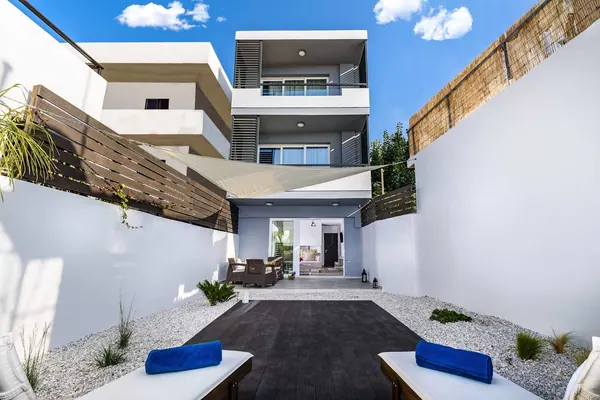 Solar Apartments building and courtyard entrance in Agia Marina, Chania