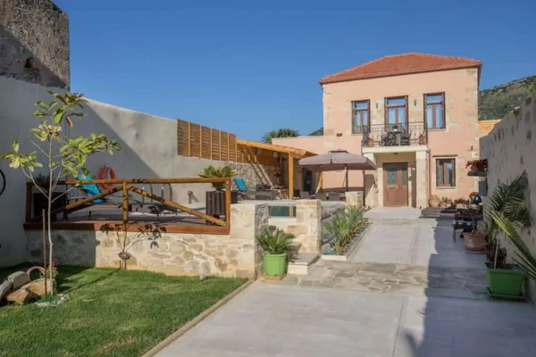 Villa Theta stone facade and garden by day, Drapanias, Kissamos region