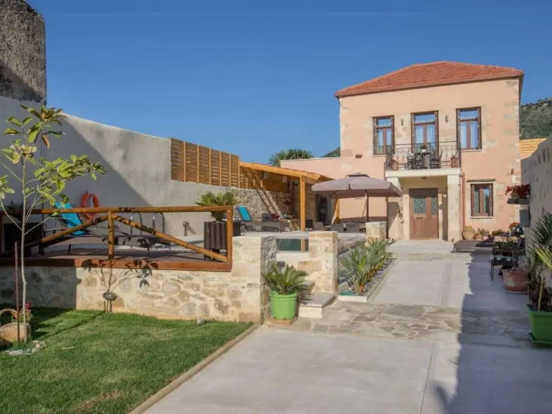 Villa Theta stone facade and garden by day, Drapanias, Kissamos