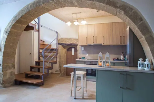 Stone arch and staircase to the first floor, Villa Theta, Drapanias
